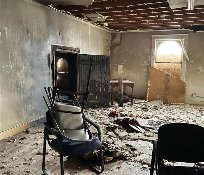Interior of a room with fire damage.