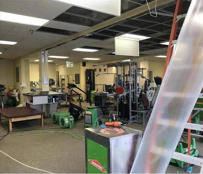 Gym suffered from water damage, drying equipment all over the room